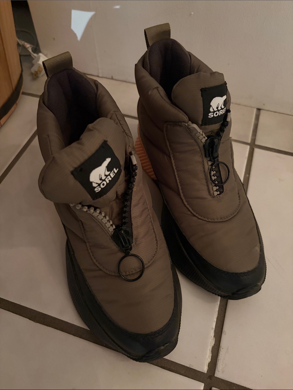 Sorel Women’s Taupe Winter Boots with Black Trim Insulated slip-on winter boots.